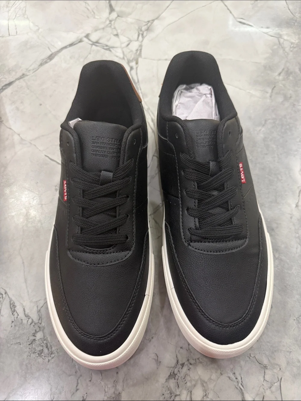 Levi's Men's Black Sneakers with Brown Heel Accent and White Sole